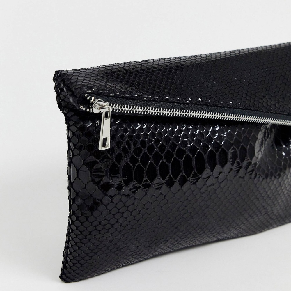 ASOS design asymmetrical snake clutch